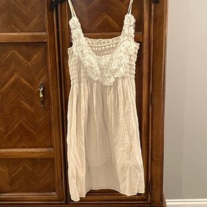 NWOT. Off white Boho Gauzy smocked summer dress. Floral detail. Size Small